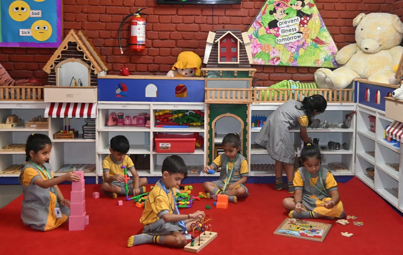 Children exploring play-based learning materials