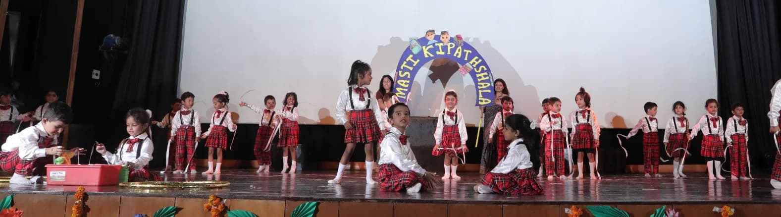 Young learners presenting Masti Ki Pathshala together on stage