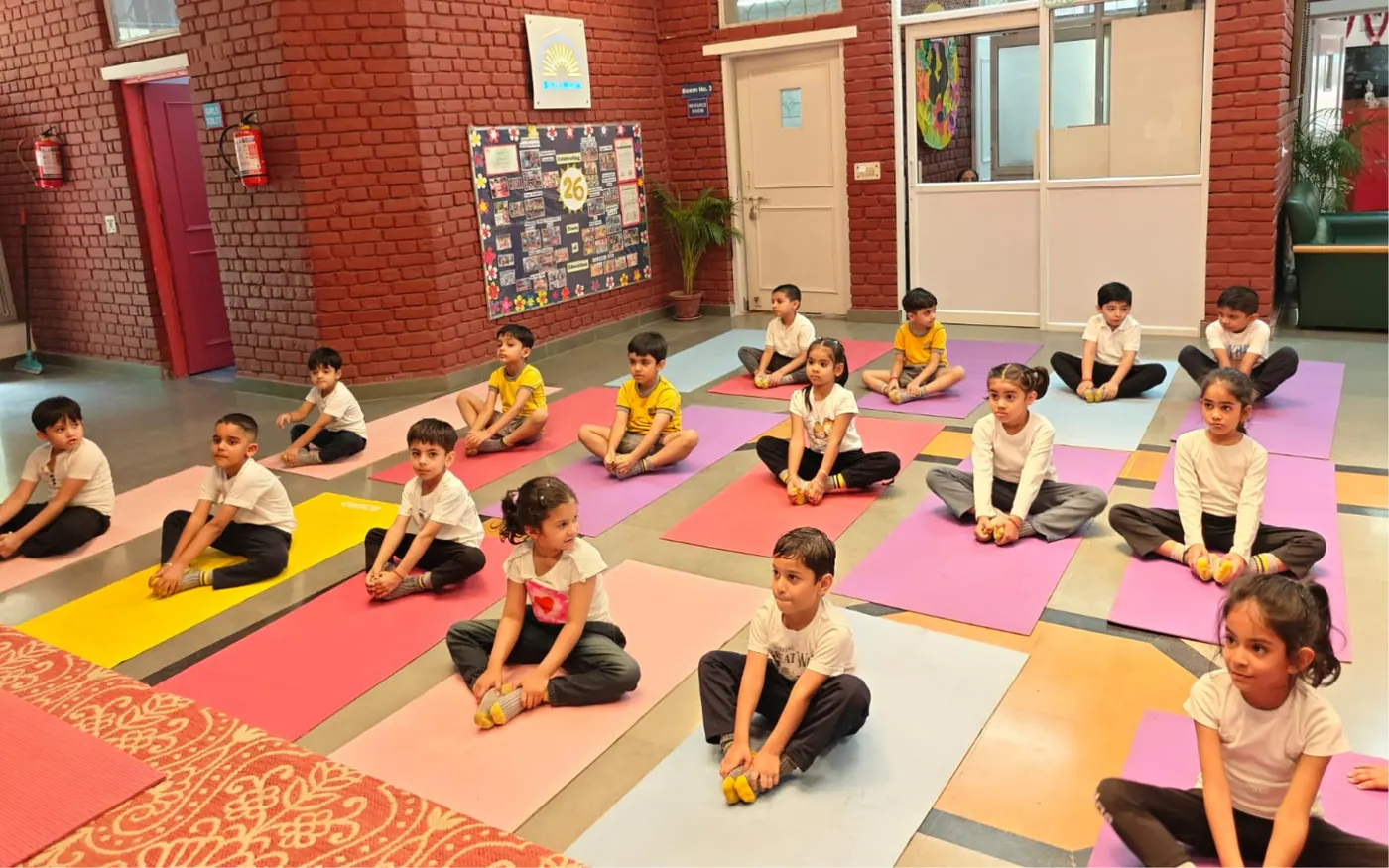 Children practising yoga together